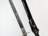 two knives that are sitting next to each other on a table