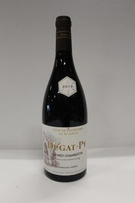 a bottle of wine that is sitting on a table