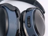 a pair of headphones sitting on a table next to a mouse