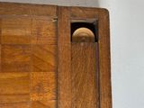 a close up of a piece of wood with a ball in it