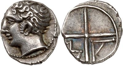 a silver coin with an image of a woman on it