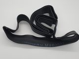 a close up of a black strap with a white background