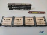 Trois produits NYX Cosmetics de New York sont posés sur une table