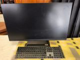 a close up of a computer monitor and keyboard on a table