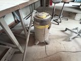 a vacuum that is sitting in the middle of a room