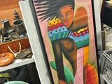 un tableau représentant une femme tenant une planche de surf à côté d'un tas d'autres objets