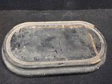 a dirty tray sitting on the floor in the room