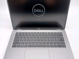 the dell laptop is open and ready to be used