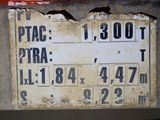 a sign on the side of a building that says ptac 1, 300ft
