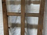two wooden ladders that are sitting on a white sheet