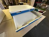 a white and blue box that is open on a table