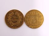 two gold coins, one of which has a coat of arms and the other of which is a coat of