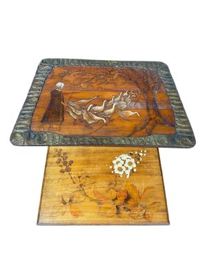 a wooden tray with a bird design on it