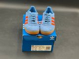 blue box with orange and white adidas sneakers on top of it
