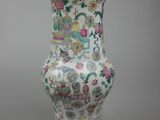an image of a white vase with a colorful design on it