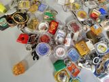 a pile of assorted key chains on a table