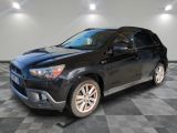 a picture of a black toyota rav parked in a garage