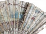 a fan that has a picture of a woman on it