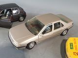 three toy cars that are sitting next to each other