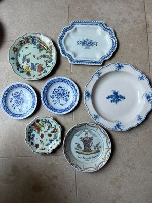 many plates and bowls on the floor on the floor