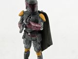 a close up of a figurine of a man with a helmet and cape