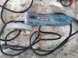 an image of a corded sander sitting on top of a cement slab