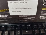 a computer keyboard with a box on top of it