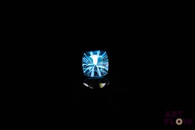 an image of a television in the dark with a blue light