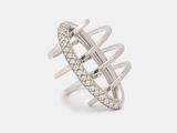 a close up of a ring with diamonds on a white background