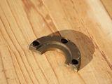 a horseshoe shaped object on a wooden table