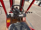 a close up view of the driver ' s seat of a tractor