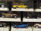 many different model cars on display in a display case