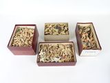 three boxes with different types of wood chips in them on a white surface