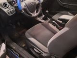 the interior of a car with a steering wheel and a dashboard