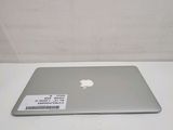 an apple macbook air laptop computer sitting on top of a white table