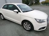 a picture of a white car parked in a parking lot