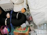 a cardboard box filled with a pile of items
