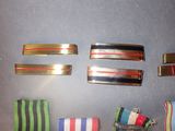 five different colors of hair clips on a table