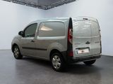 a silver van that is parked in a room