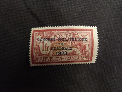 a stamp with a picture of a man and woman on it