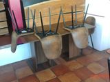 a bench that has a bunch of brooms on it