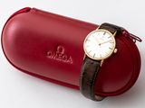 an image of a watch sitting on top of a red case