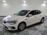 a white car parked in a room with a checkered floor