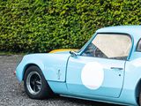 an image of a blue sports car parked in a parking lot