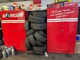 a pile of tires stacked on top of each other in a garage