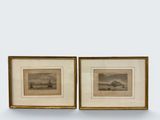two framed prints of boats on the water in a gold frame