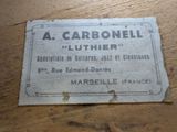 an old label on a wooden table that says a carbonell luther