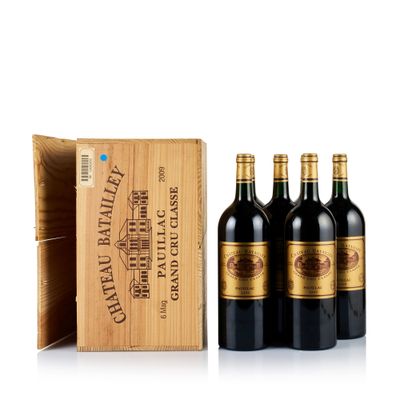 three bottles of wine in a wooden box with a wooden box behind them