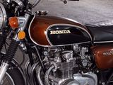 a brown and black motorcycle parked in a garage