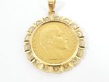 an image of a gold coin pendant with a woman ' s face